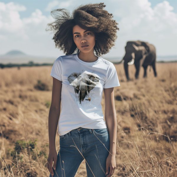 African female wearing an elephant crew neck t-shirt with an elephant in the background